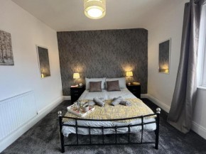 Modernised central Wigan townhouse sleeps up to 6